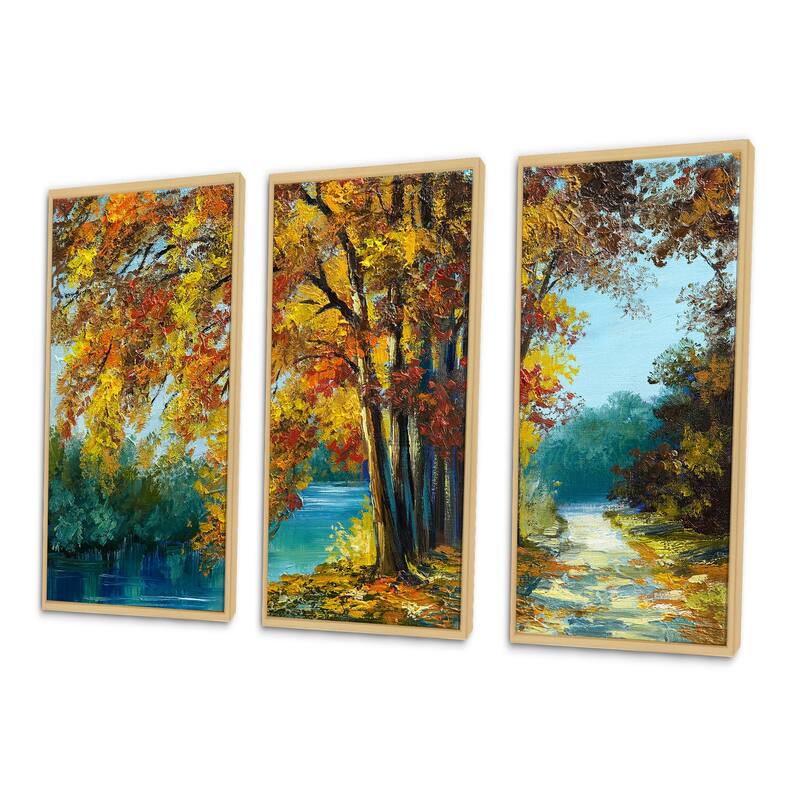 Designart "Trees In Warm Autumn Colors By Bright Blue River