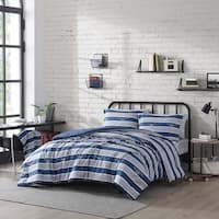 https://ak1.ostkcdn.com/images/products/is/images/direct/6c62fcf4ae8be4ad109df5d5877fb494adc366b4/Nautica-Thorton-Lake-Reversible-Grey-Multi-Piece-Bed-Set.jpg?imwidth=200&impolicy=medium