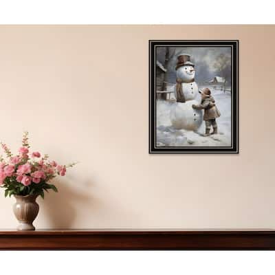 HomeRoots Boy Building A Snowman Black Framed Wall Art