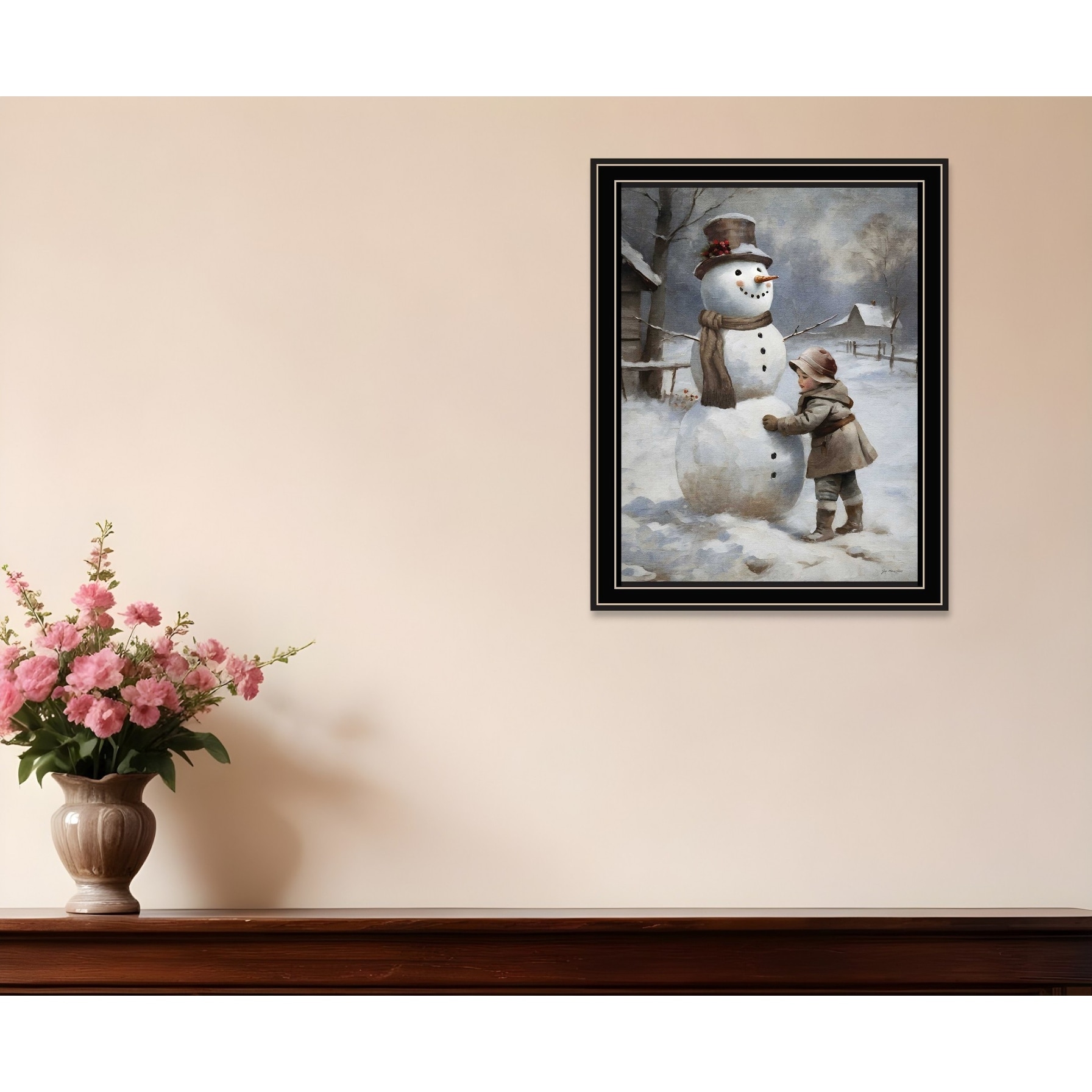 HomeRoots Boy Building A Snowman Black Framed Wall Art