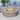 COSIEST Ecru Round Outdoor Propane Fire Pit with Wind Guard