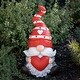 preview thumbnail 1 of 3, Magnesium Garden Gnome Sitting Holding Big Heart with Red Hat None - Pink and Red - Medium