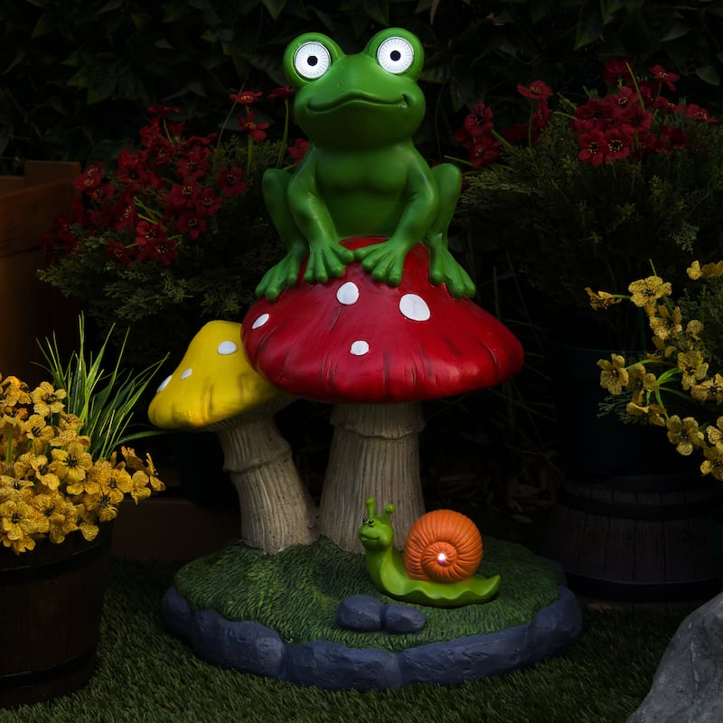 Solar Frog Sitting On Top of Mushroom Statue