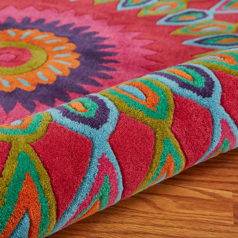 Sevita Bursting Peacock Wool Area Rug