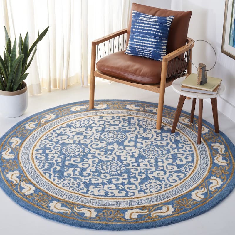 SAFAVIEH Handmade Antiquity Lauresha Wool Rug - 6' Round - Blue/Ivory