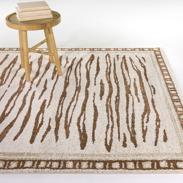 slide 2 of 5, Rhea Boho Animal Print Area Rug 5'3" x 7' - Tan