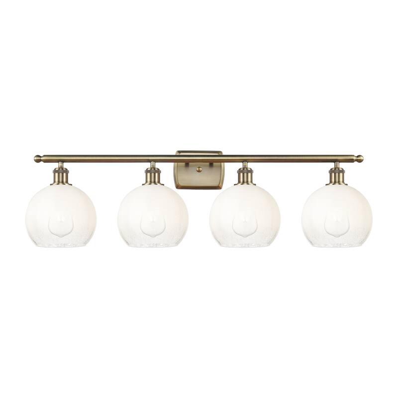Innovations Lighting Endless Possibilities Ballston - Brookhaven Globe - 4 Light 38" Bath Vanity Light - Antique Brass/Opal