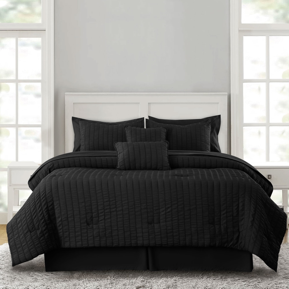 Black bed in top a bag queen