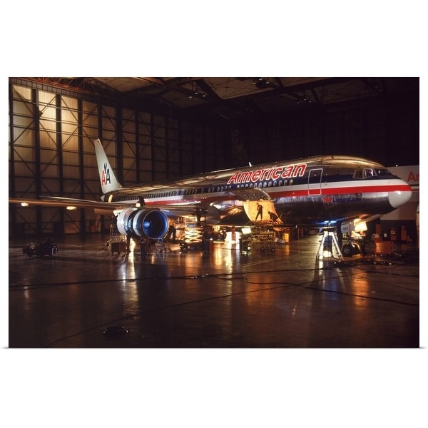 "Loading cargo into the airplane at night" Poster Print