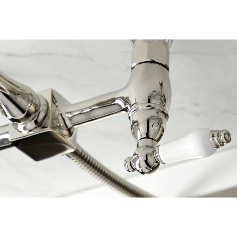 Kingston Brass Heritage Wall Mount Bridge Kitchen Faucet with Brass Sprayer