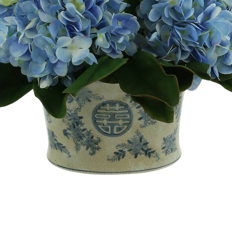 Hydrangea and Magnolia Leaf Arrangement in a Decorative Ceramic Pot - Blue, White, Green