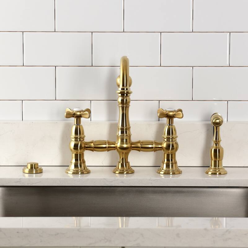 Kingston Brass Essex Two-Handle 4-Hole Deck Mount Bridge Kitchen Faucet with Brass Side Sprayer