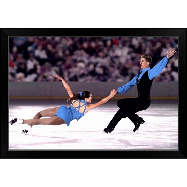 "Figure skating pair performing in front of crowd" Black Framed Print