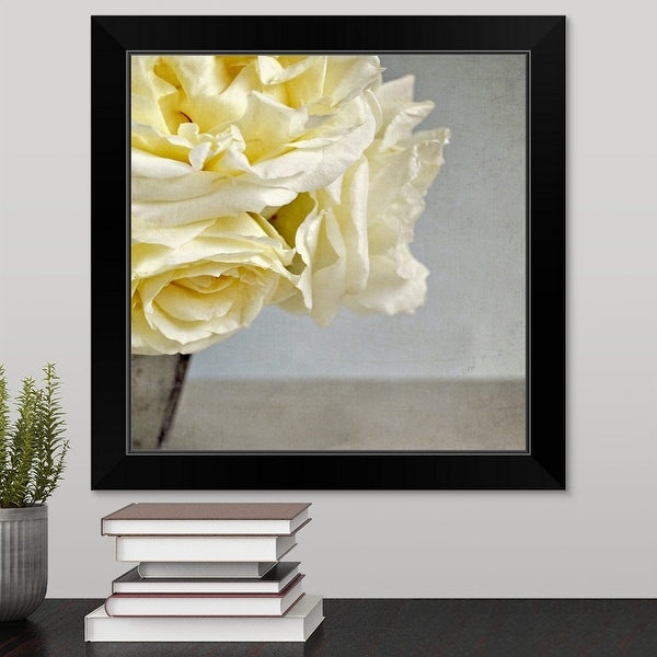 "Cream vanilla roses in silver vase against Grey/blue background." Black Framed Print
