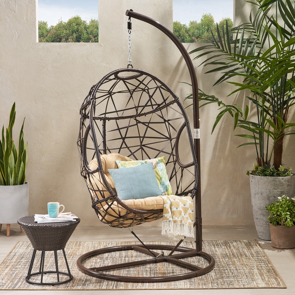 https://ak1.ostkcdn.com/images/products/is/images/direct/6e91810d94d0c13b60d650d2e0a2bfc5391b5df4/Bushnell-Wicker-Hanging-Chair-by-Christopher-Knight-Home.jpg