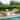 Cambridge Casual Lowell Teak 4-Piece Outdoor Patio Conversation Set with Daybed, Rocking Chairs, and Coffee Table