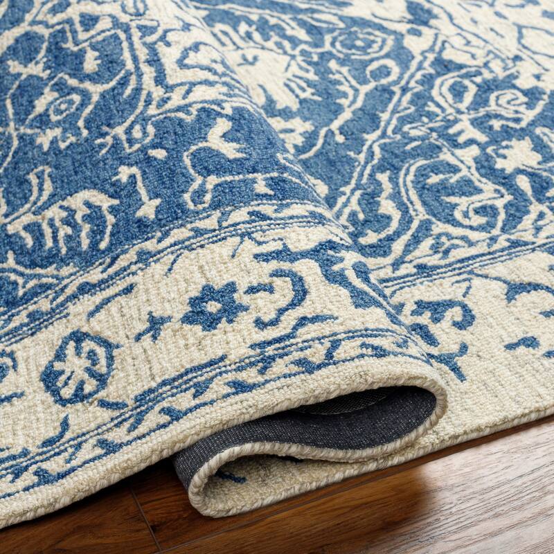 Felecia Handmade Distressed Medallion Wool Area Rug