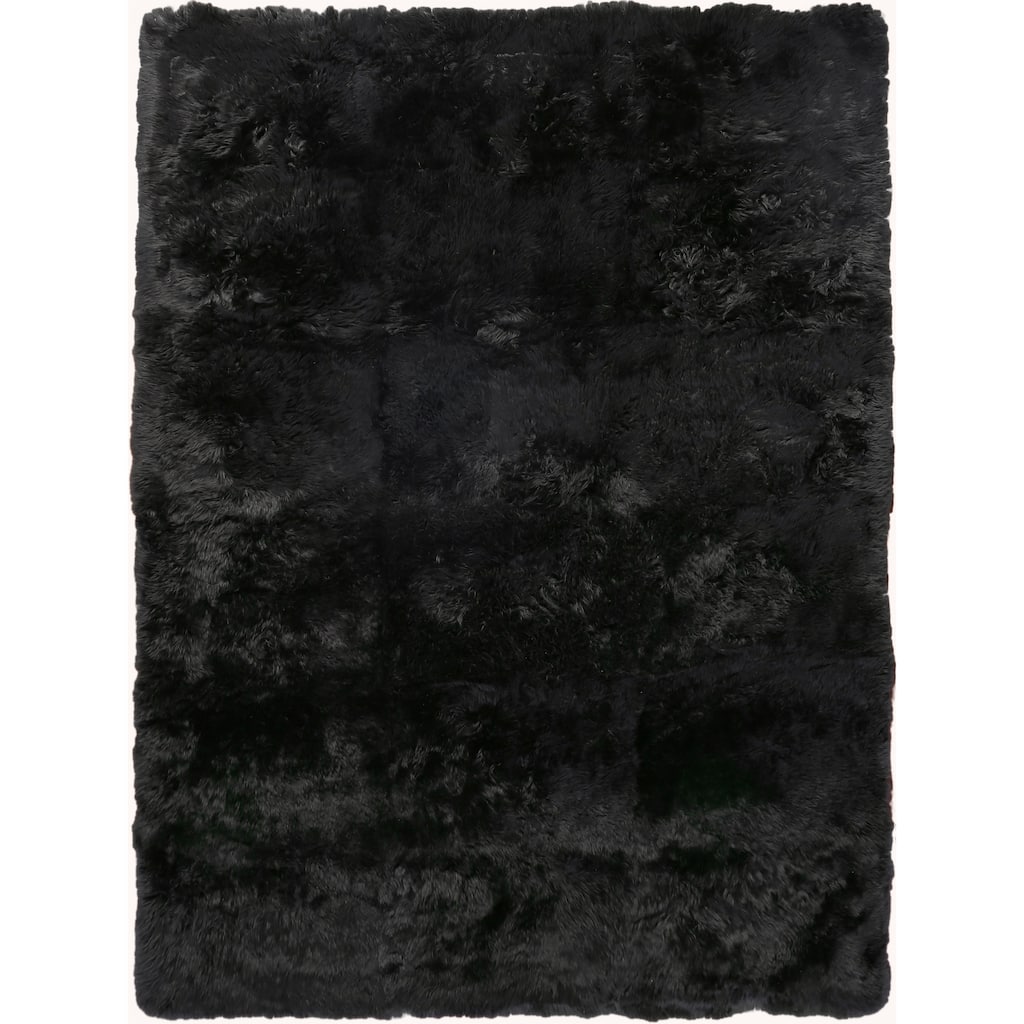 EXQUISITE RUGS Sheepskin Hand-stitched Black Area Rug.