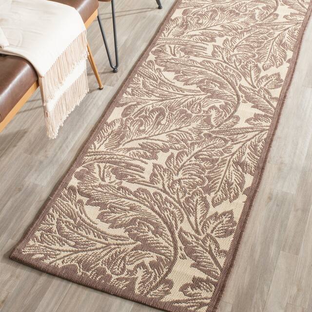 SAFAVIEH Courtyard Bettyjane Tropical Leaves Indoor/ Outdoor Area Rug - 2'3" x 6'7" Runner - Natural/Chocolate