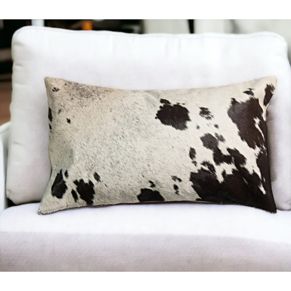 HomeRoots 12" X 20" Chocolate And White Abstract Spots Cowhide Throw Pillow