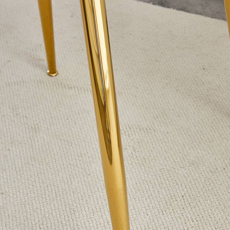 A glass tabletop with a diameter of 40 inches and a modern minimalist circular dining table with gold plated metal legs