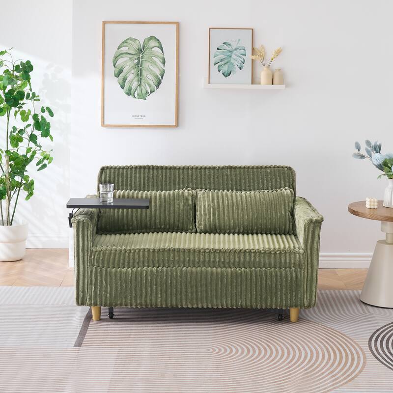 The pull-out and push-in green corduroy sofa with dual functions,equipped with a movable tabletop and USB ports