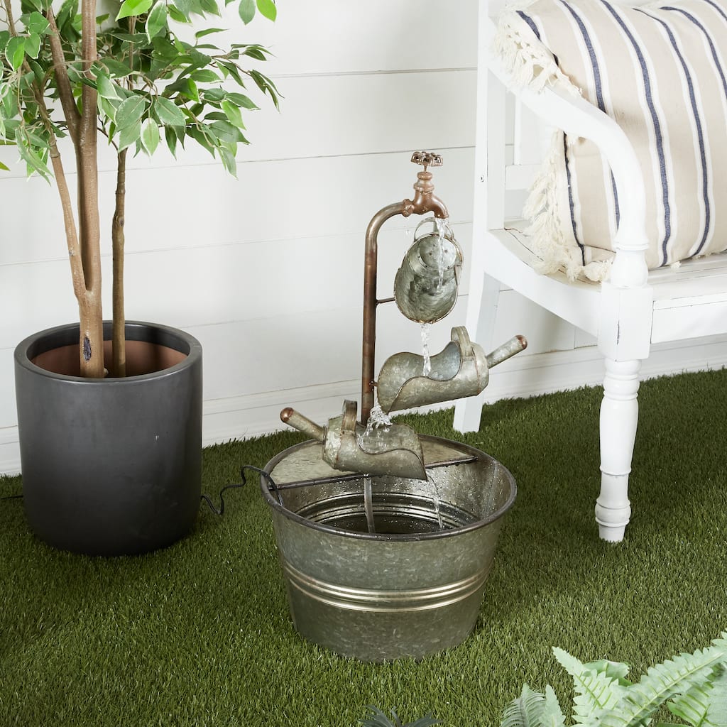 Gray Metal Fountain with Watering Cans