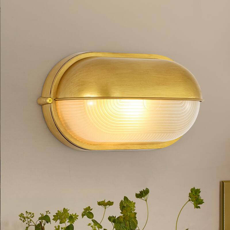 11"W 1-Light Retro 40W Oval Painted Gold Finish Wall Sconce with Clear Rippled Glass - 11.0 in. W x 6.3 in. H x 4.7 in. D - 11.0 in. W x 6.3 in. H x 4.7 in. D - Clear/Gold