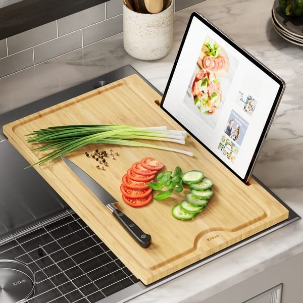 https://ak1.ostkcdn.com/images/products/is/images/direct/716e75113d0d73fb70964251afee1c7e0a251d3f/KRAUS-Solid-Bamboo-Cutting-Board-for-Kitchen-Sink.jpg?impolicy=medium