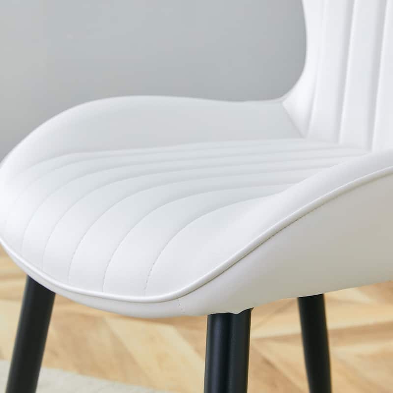 The White Minimalist Ergonomic Dining Chair Comes In A Pack of 4, With A Comfortable Design Of Extended And Curved Seat Cushions