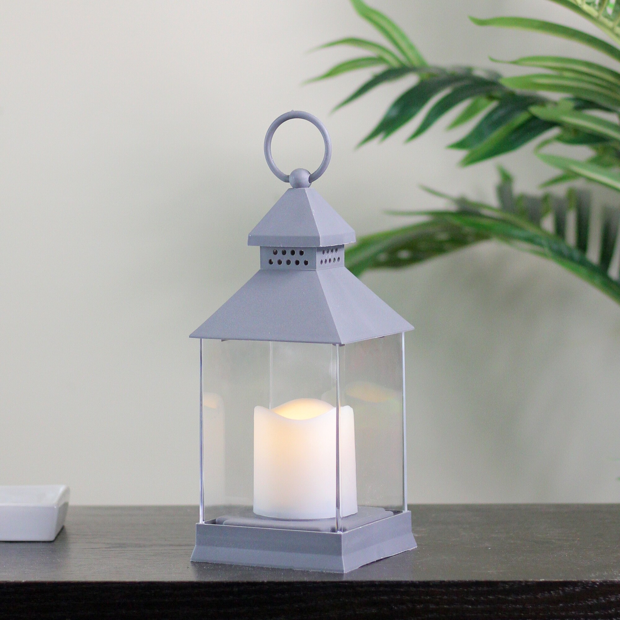 https://ak1.ostkcdn.com/images/products/is/images/direct/720756d2ac3b75b52661f105838c094fa3216bf0/9.5%22-Dark-Grey-Candle-Lantern-with-Flameless-LED-Candle.jpg