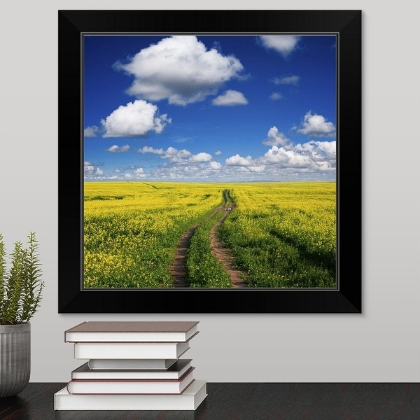 "Wide angle view of tracks in a canola field" Black Framed Print