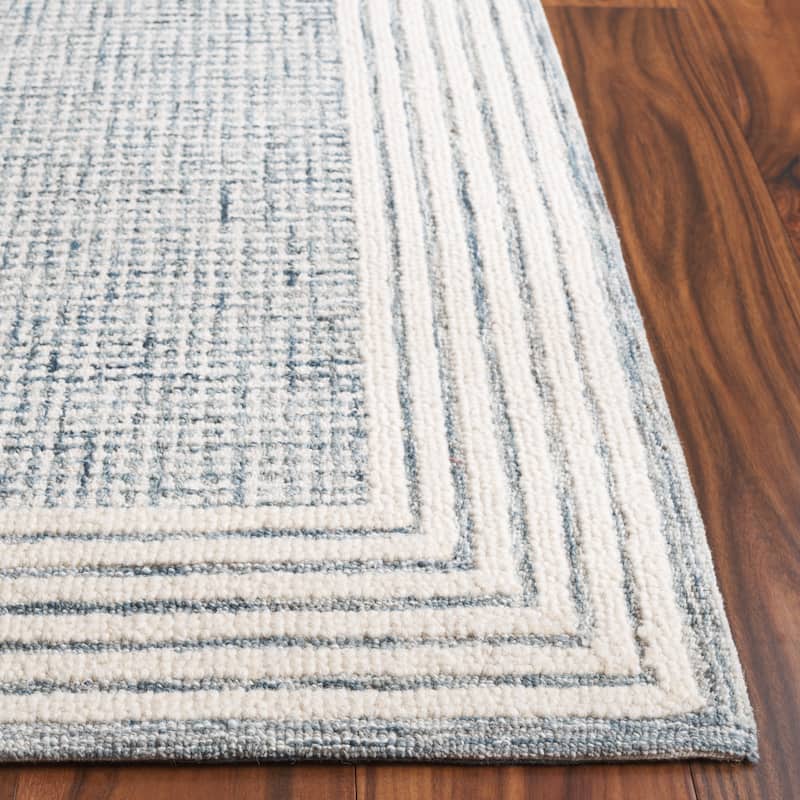 SAFAVIEH Handmade Ebony Dorith Border Wool Rug