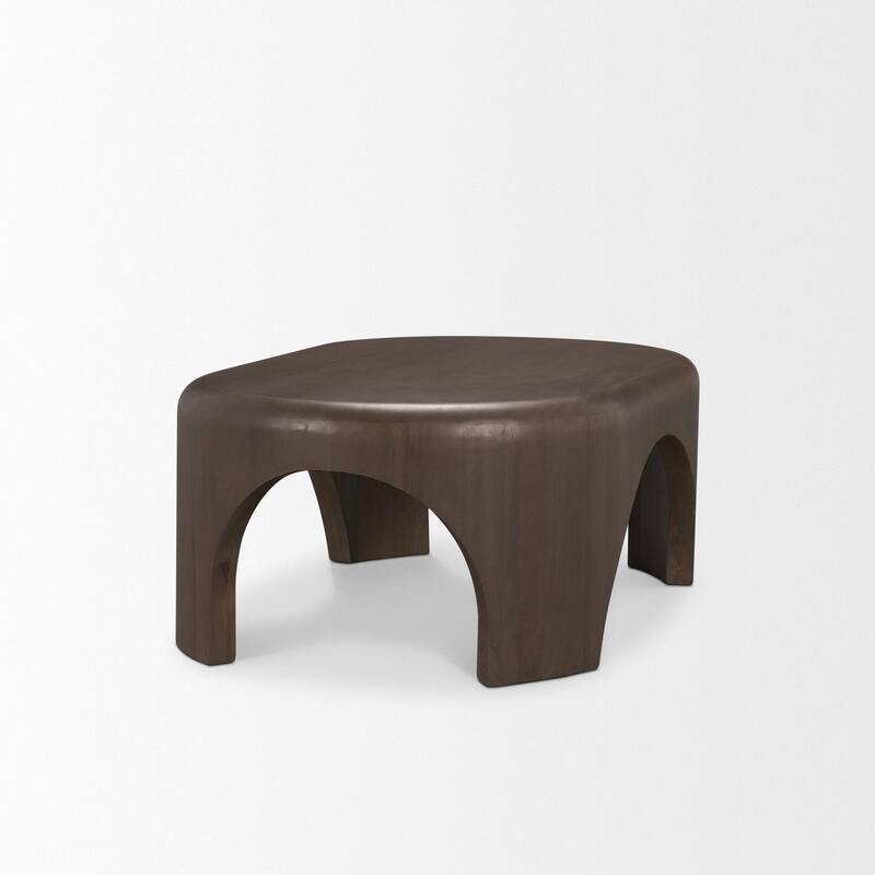 The Shima Coffee Table is a smooth, dark matte brown oval coffee table with curved edges and arched cut out legs.