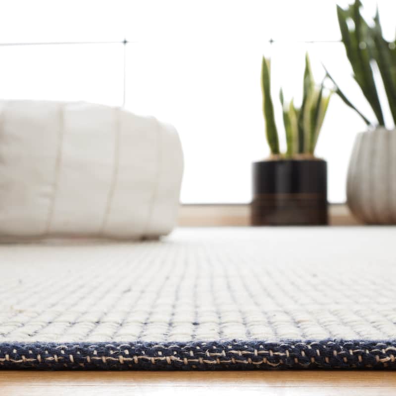 SAFAVIEH Handmade Ebony Cheol Modern Wool Rug