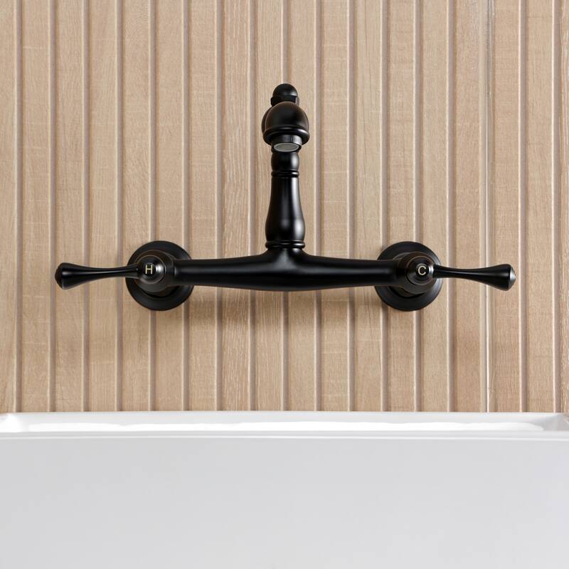 Kingston Brass English Country Two-Handle 2-Hole Wall Mount Bathroom Faucet