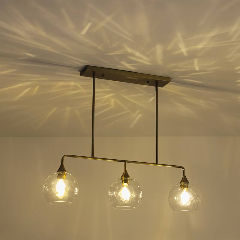 3-Light Modern Black/Brushed Gold Linear Chandelier for Kitchen Island with Clear Textured Glass Globe Shades