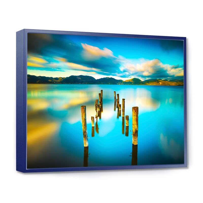 Designart "Cloudy Lake with Broken Pier" Seascape Framed Canvas Art Print - 20 in. wide x 12 in. high - Blue