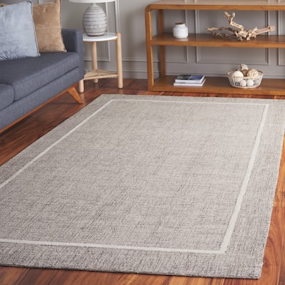 SAFAVIEH Hand-Tufted Ebony Hanni Modern & Contemporary Wool Rug