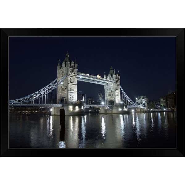 "A view across the River Thames to Tower Bridge illumunated at night" Black Framed Print