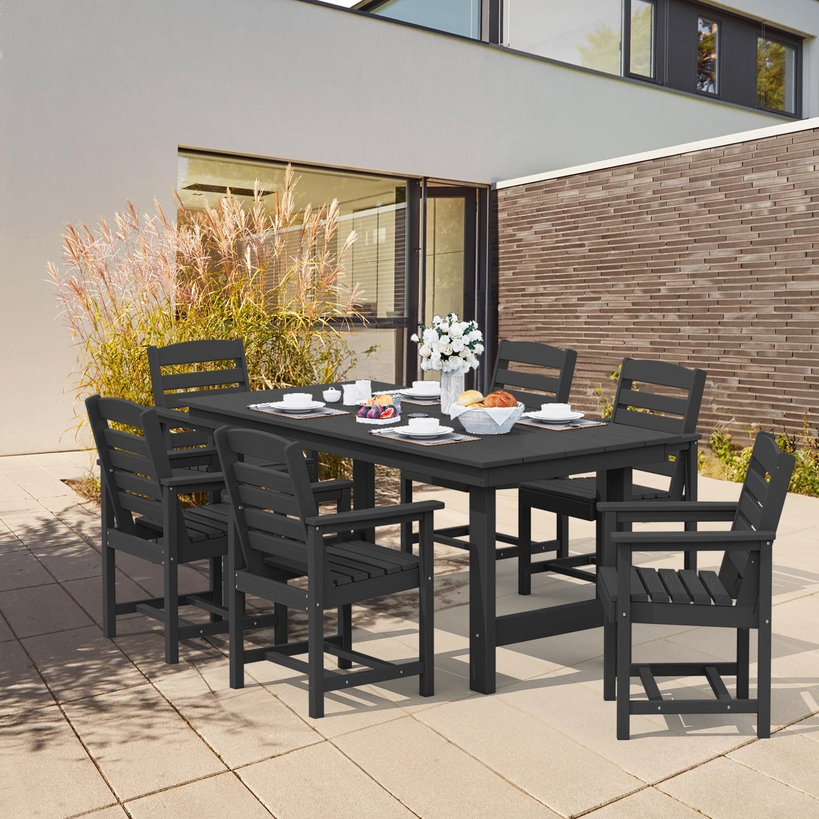 Narrow outdoor dining table with umbrella hole top