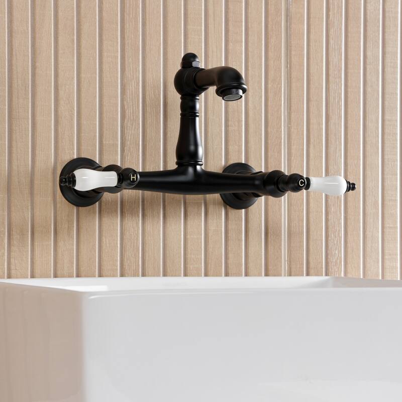 Kingston Brass English Country Two-Handle 2-Hole Wall Mount Bathroom Faucet