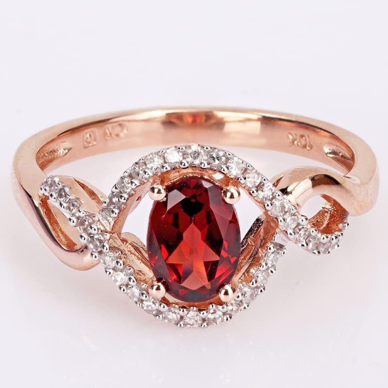 Miadora 10k Rose Gold Garnet and 1/6ct TDW Diamond Halo Infinity Ring