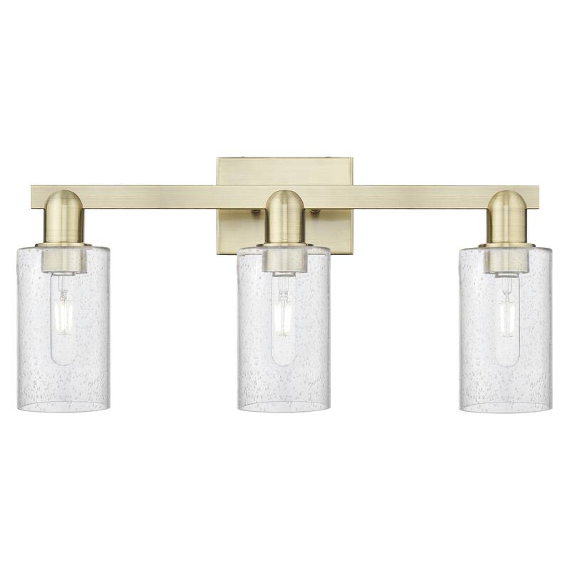 Innovations Lighting Endless Possibilities Arcadia - Clymer - 3 Light 23" Bath Vanity Light - Antique Brass/Seedy