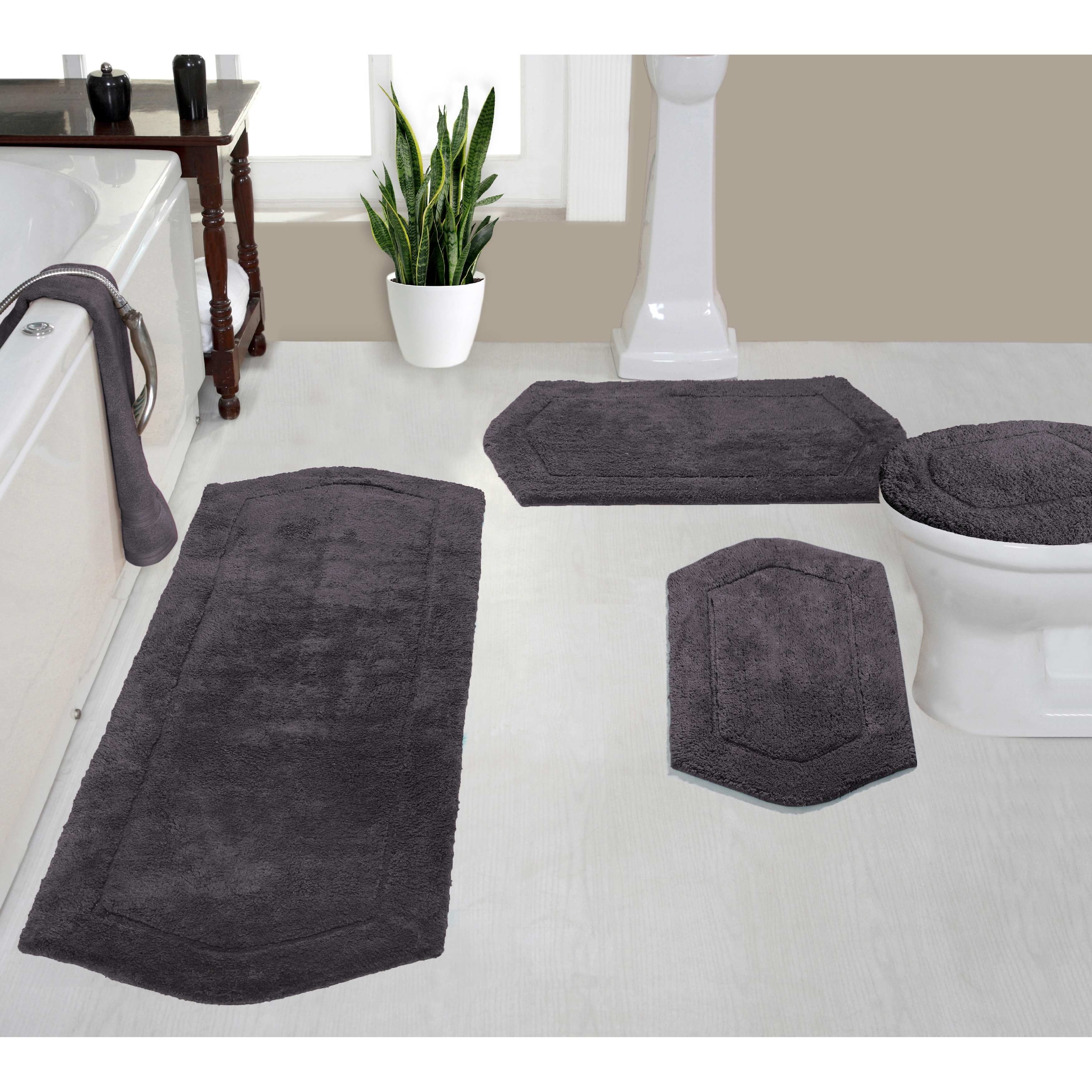 https://ak1.ostkcdn.com/images/products/is/images/direct/75fc28d6c6470af772fc516c84b13ad872294563/Home-Weavers-Bathroom-Rug%2C-Cotton-Soft%2C-Water-Absorbent-Bath-Rug%2C-Non-Slip-Shower-Rug-4-Piece-Set-with-Toilet-Lid-Cover.jpg