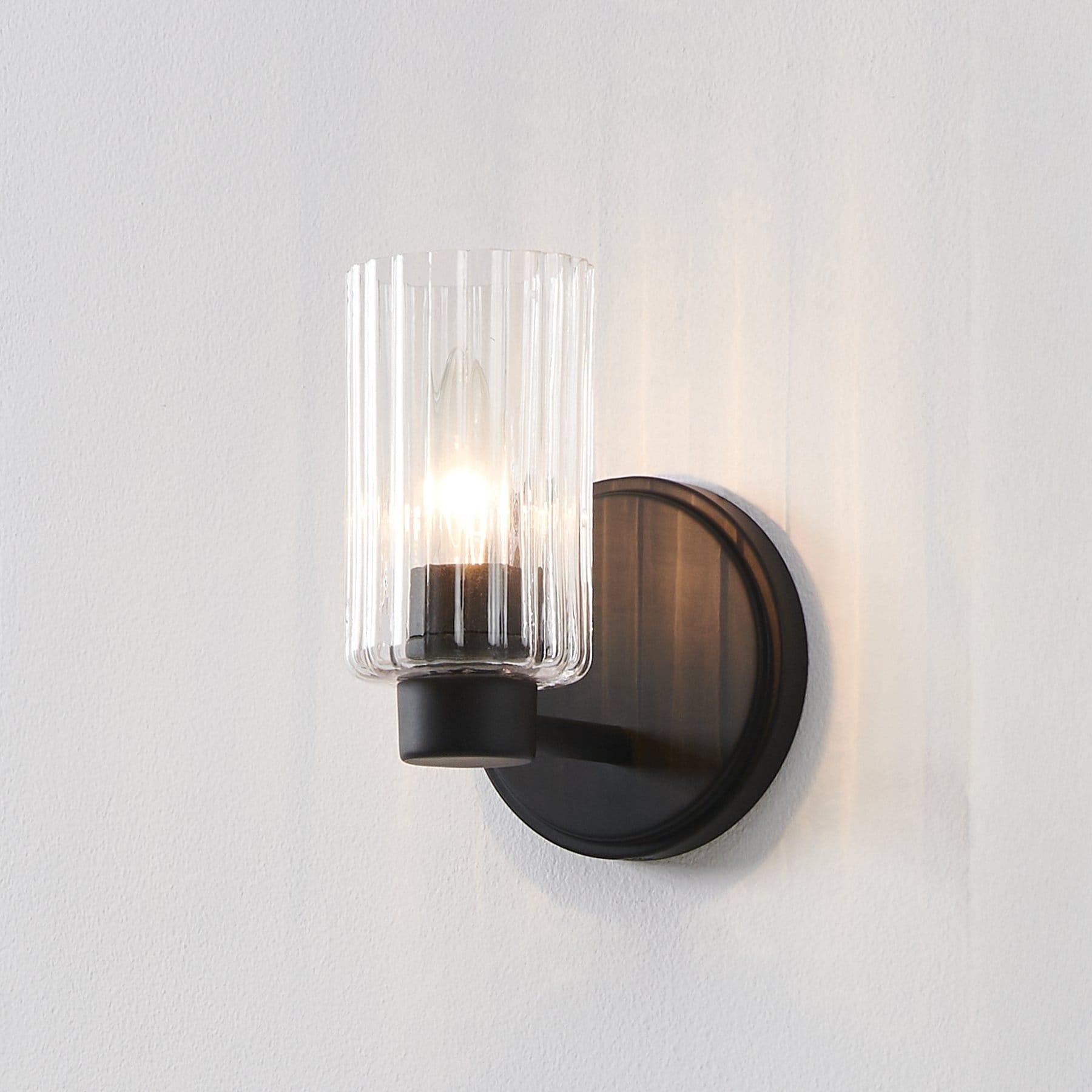 Thesis Bedminster 5-inch 1-light Matte Black Vanity Light with Clear Ribbed Glass Shade