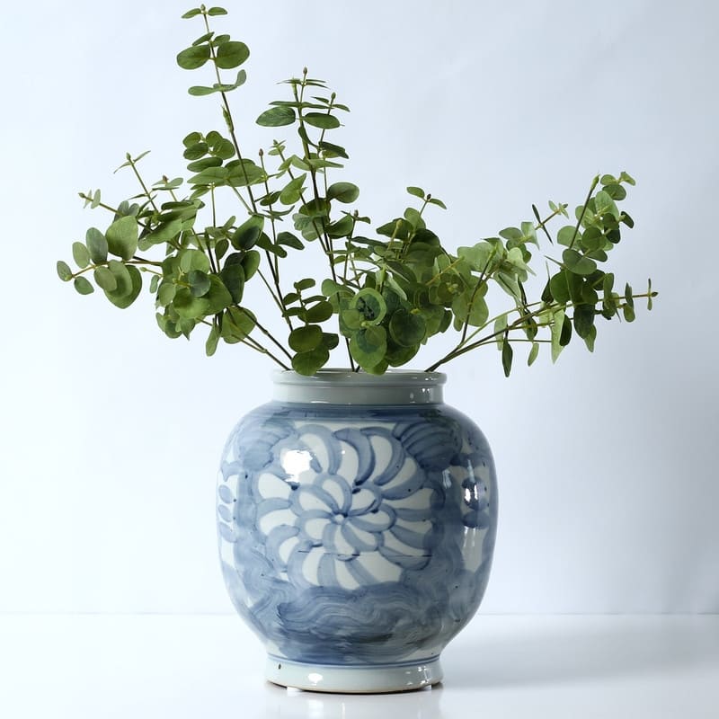 Approx. 10 Inches Tall Blue and White Vase with Flower Motif