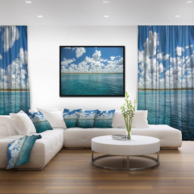 Designart "White Fluffy Clouds Over Sea" Oversized Beach Framed Canvas Artwork Print