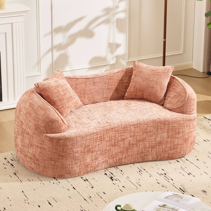 Curved 2 person compress sofa. It has armrests on both sides, comes with two pillows,is suitable for small - sized apartments