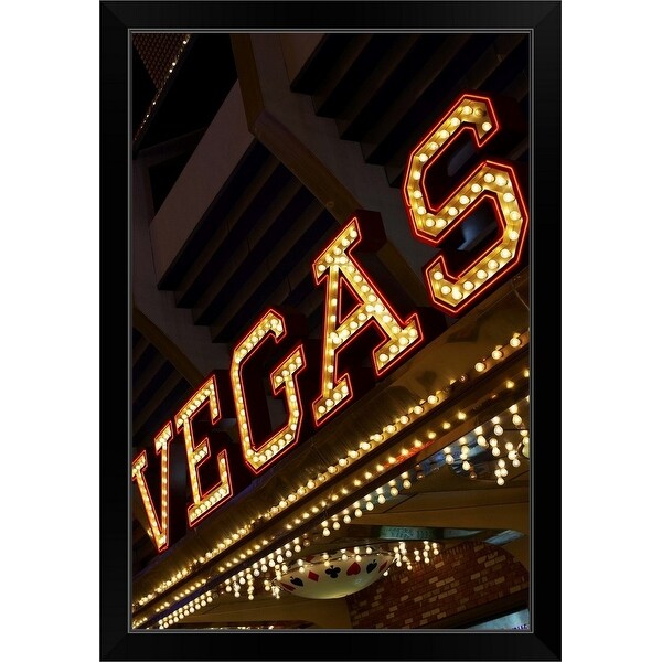 "Illuminated Vegas sign" Black Framed Print